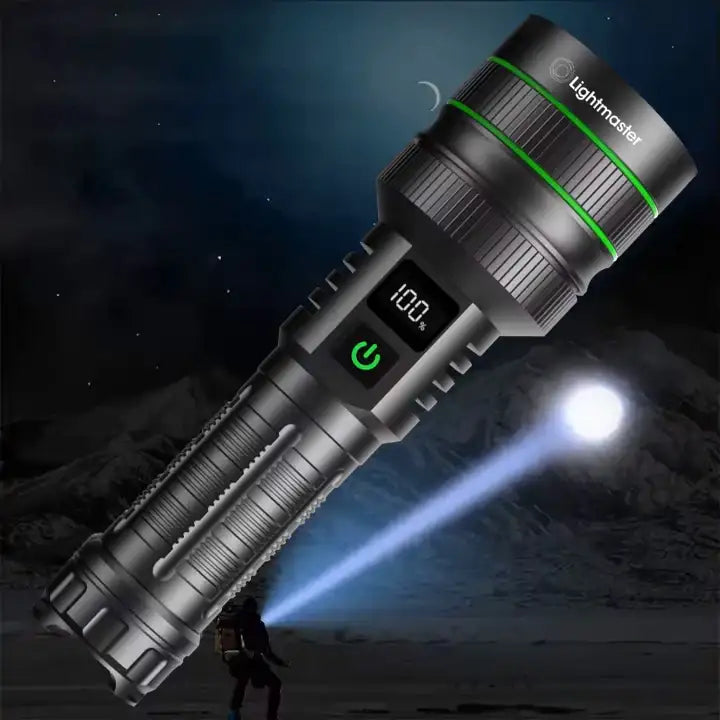 Black Lightmaster tactical flashlight with LED battery indicator shining bright beam on night outdoor terrain